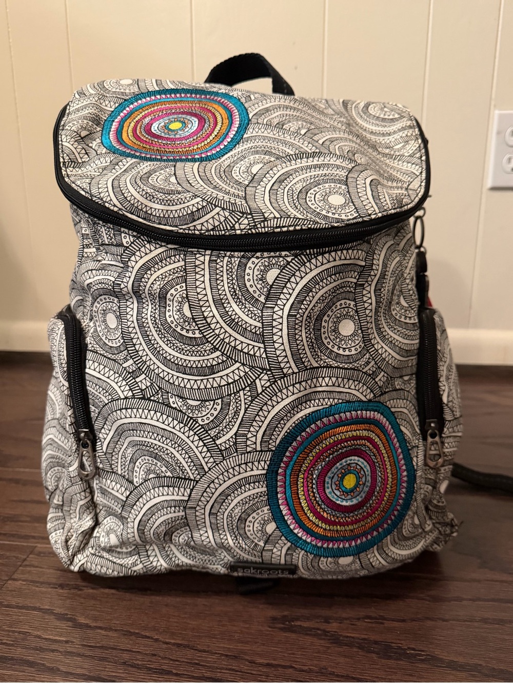 Sakroots White & Black Canvas Backpack with Multicolor Embroidered Circles